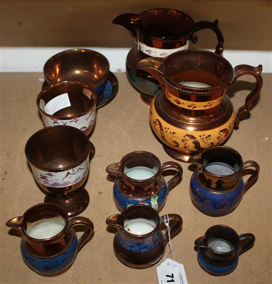 Collection of five Victorian copper lustre jugs and a pair of goblets